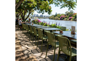 A commercial outdoor dining space featuring the Bordeaux Stacking Polypropylene Outdoor Dining Chair in Olive.