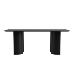 A straight-on view of the long side of the Munoz Dining Table in matte black, showcasing the 200cm rectangular top and the deeply inset curved steel legs creating a floating illusion.