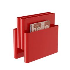 A front-angled view of the Gloss Red Replica Giotto Stoppino Magazine Rack, styled beautifully with magazines to demonstrate the visibility provided by the four stepped storage pockets.