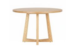 A front-angled view of the 120cm Zodiac Scandinavian Round Dining Table, showcasing the striking solid ash cross-leg base and the thick natural ash veneer top.