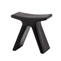 An angled perspective of the plastic Black Butterfly Stool, clearly highlighting the sweeping, curved silhouette inspired by butterfly wings and the bold, dark finish.