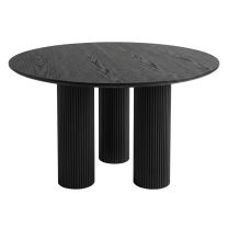 A straight-on front view of the bold modern Doric Dining Table 120 cm Round featuring a black painted oak veneer top and three thick cylindrical fluted legs finished in matte black.