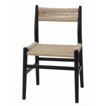Angled front view of the Fitzroy Rattan Dining Chair, highlighting the beautiful contrast between the sleek black timber frame and the natural woven rattan seat.