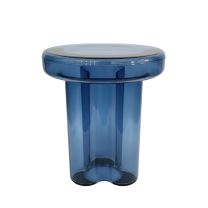 A straight-on front view of the Napier Retro Glass Side Table in azure blue, highlighting the thick moulded glass construction and unique curved base.