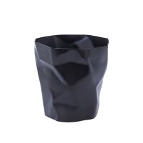 A straight-on front view of the bold black Replica Bin Bin, showcasing its highly clever design moulded to perfectly resemble a piece of crumpled paper.