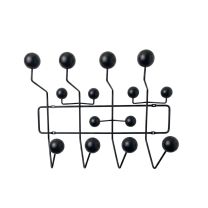 A straight-on front view of the all-black Replica Charles Eames Coat Hanger, showcasing the seamless monochromatic design of the black steel frame and matching solid wood balls.