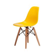 An angled front perspective of the cheerful yellow Replica Charles Eames Kids Chair, highlighting the highly practical, easy-to-clean plastic shell and the sturdy beech timber legs.