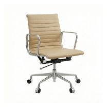 Angled front view of the low back Replica Charles Eames Office Chair, highlighting its warm Desert Sand leather upholstery and sleek cast aluminium frame.