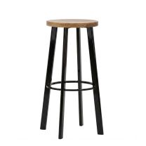 An angled perspective of the black Replica Deja-vu Bar Stool, highlighting the sturdy footrest and the beautifully carved, organic curves of the timber seat.