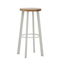 An angled perspective of the white Replica Deja Vu Bar Stool, highlighting the sturdy footrest and the beautifully carved, organic curves of the timber seat.