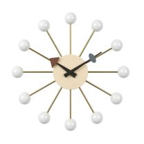 Front-on view of the mid-century inspired Replica George Nelson Ball Clock, featuring crisp white wooden balls attached to sleek steel spokes radiating from a central dial.