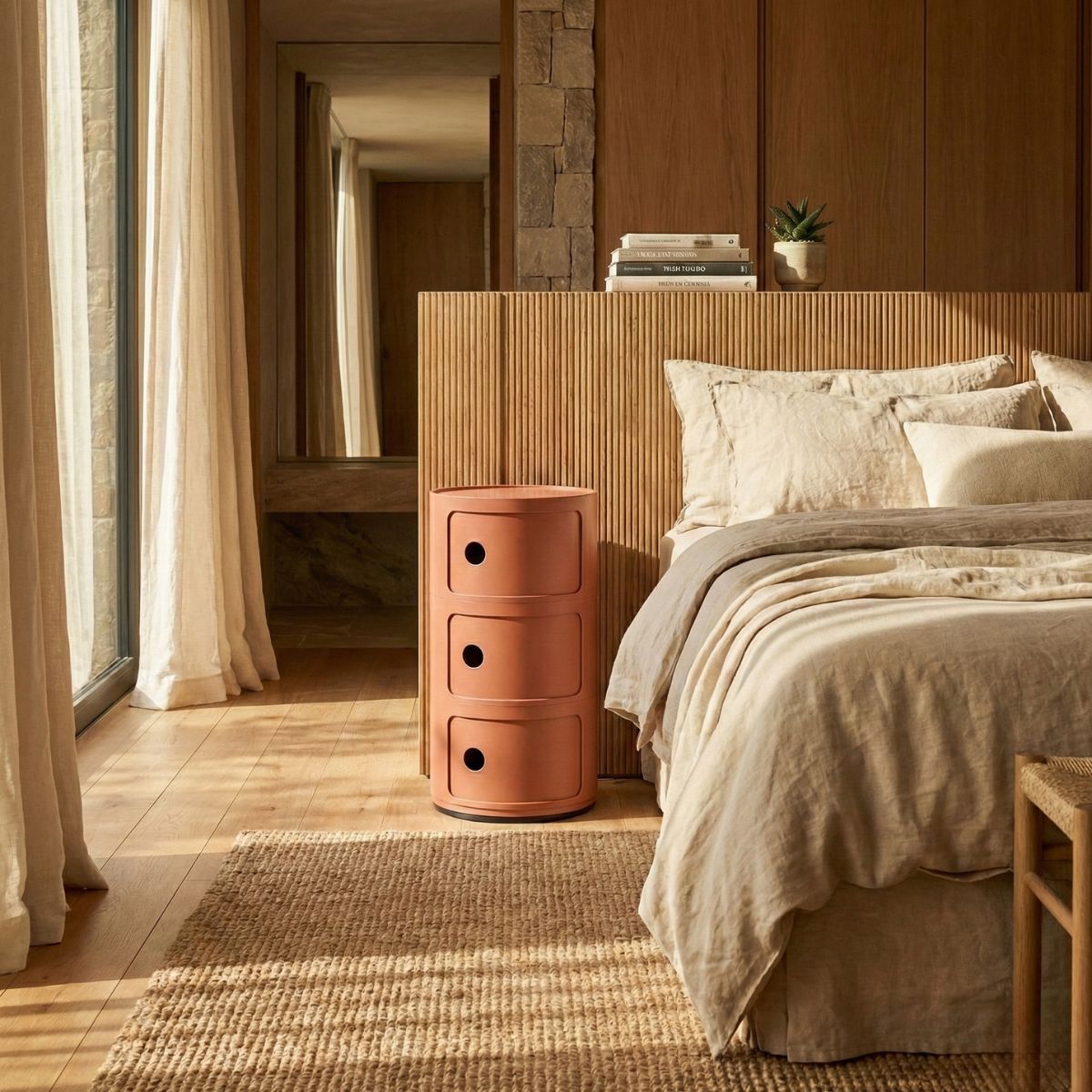A beautifully styled Replica Componibili 3 Tier in Dusty Terracotta used as a modern bedside table in an organic modern Australian bedroom.