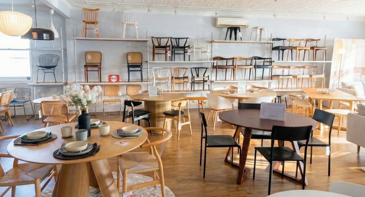 Interior of the Replica Furniture showroom in Kedron, Brisbane, featuring a wide range of dining chairs and tables.