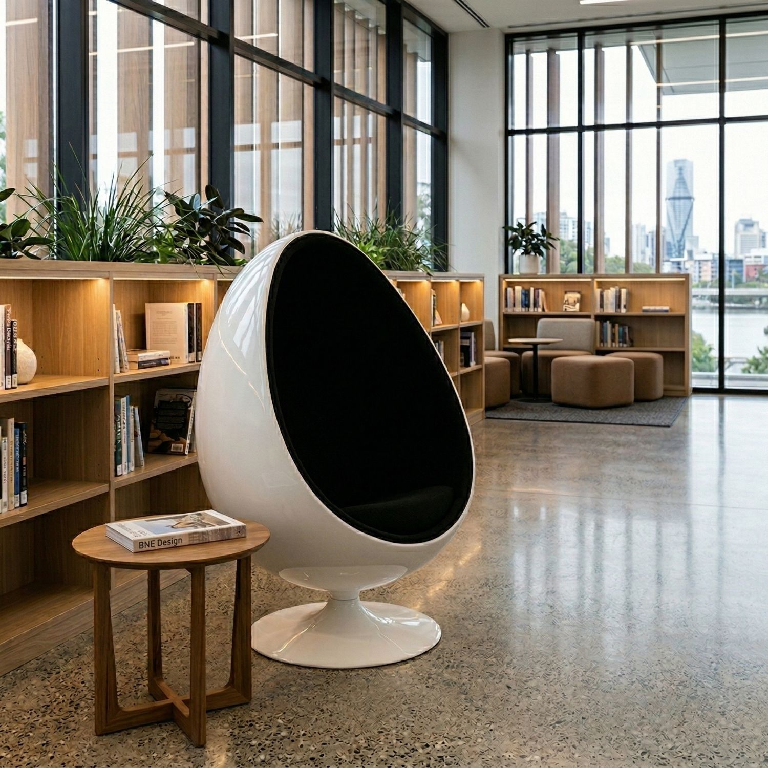 The Replica Ovalia Egg Chair by Henrik Thor-Larsen functioning as a sleek, acoustic dampening sensory pod in a modern library.
