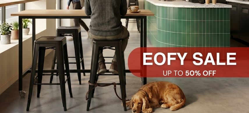 EOFY Sale: 160cm ash timber bar table on wheels styled with matching black metal replica Xavier Pauchard bar stools in a moody inner-city cafe. Up to 50% off.