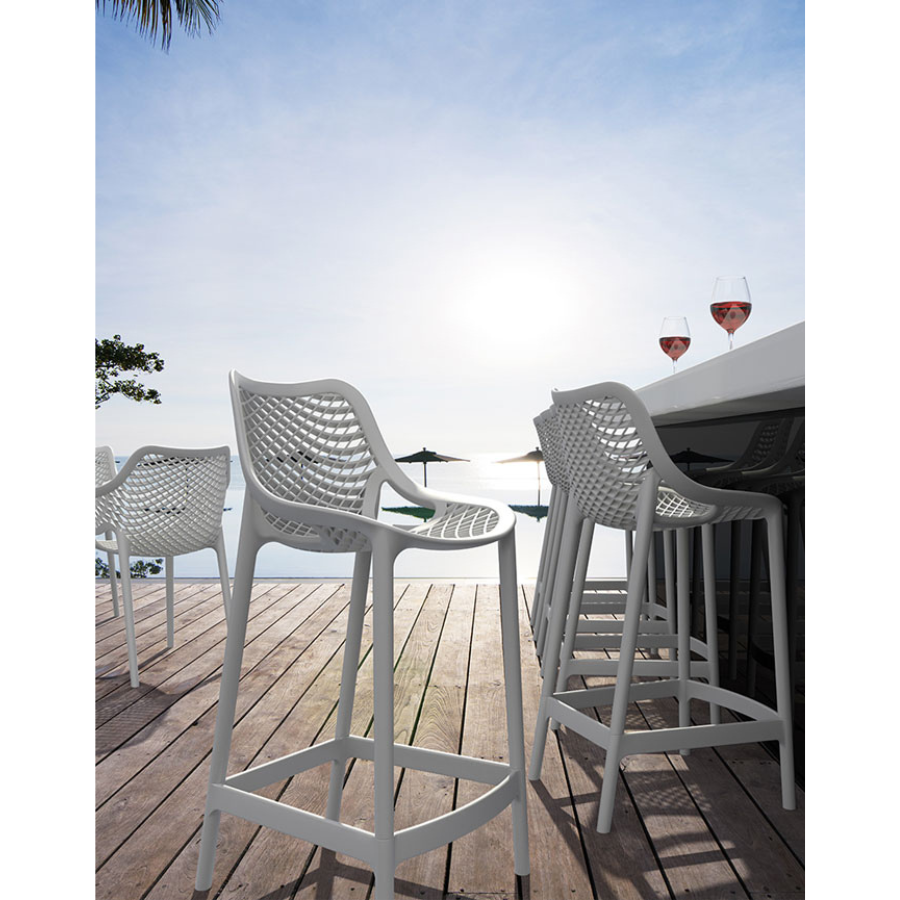 Outdoor image of White Polypropylene Bar Stool with Back Rest, 4 legs, and Side Handles