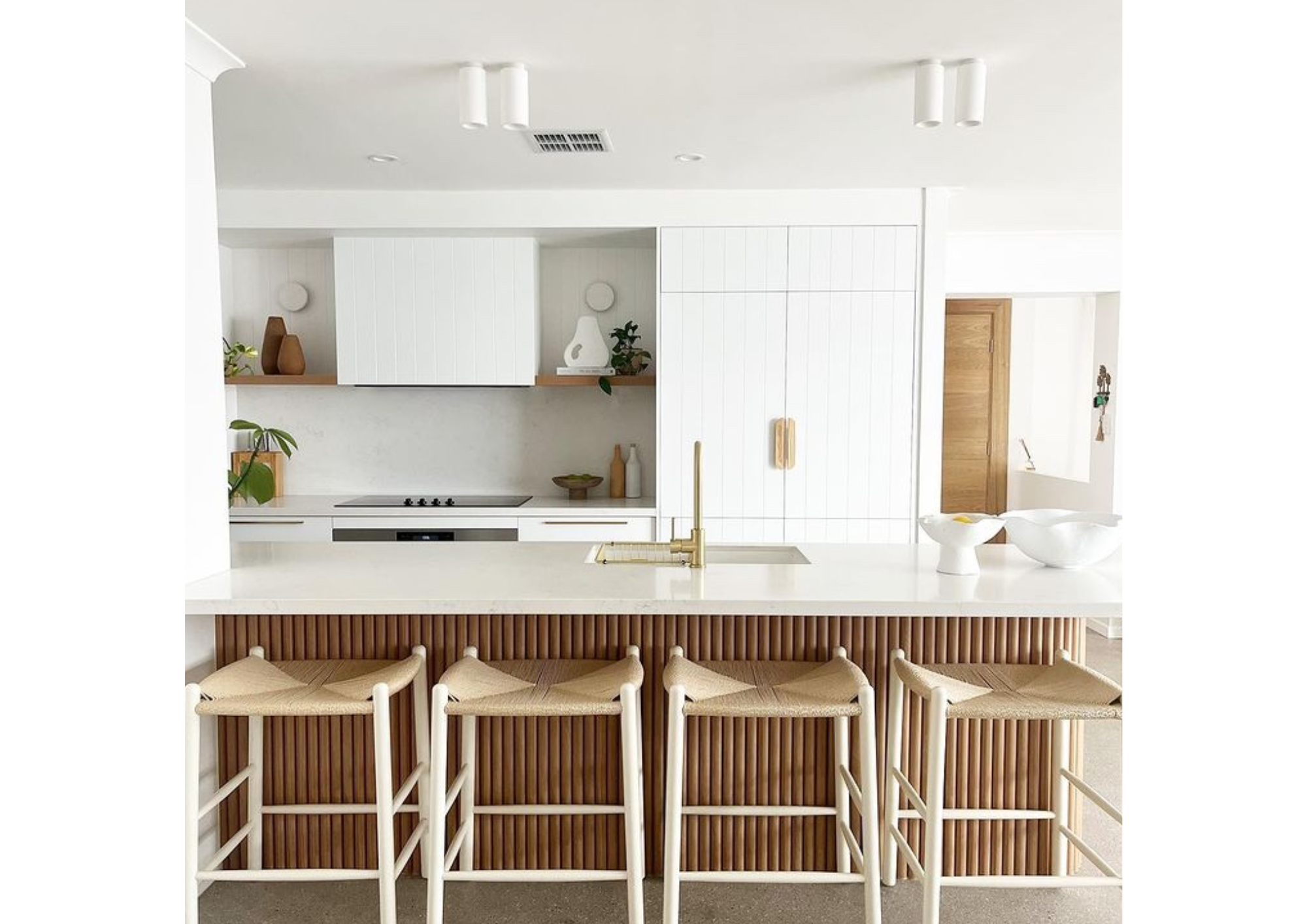 Kitchen bench styled with four Replica Jorgen Baekmark J164C Counter Stools, featuring white oak and natural cord
