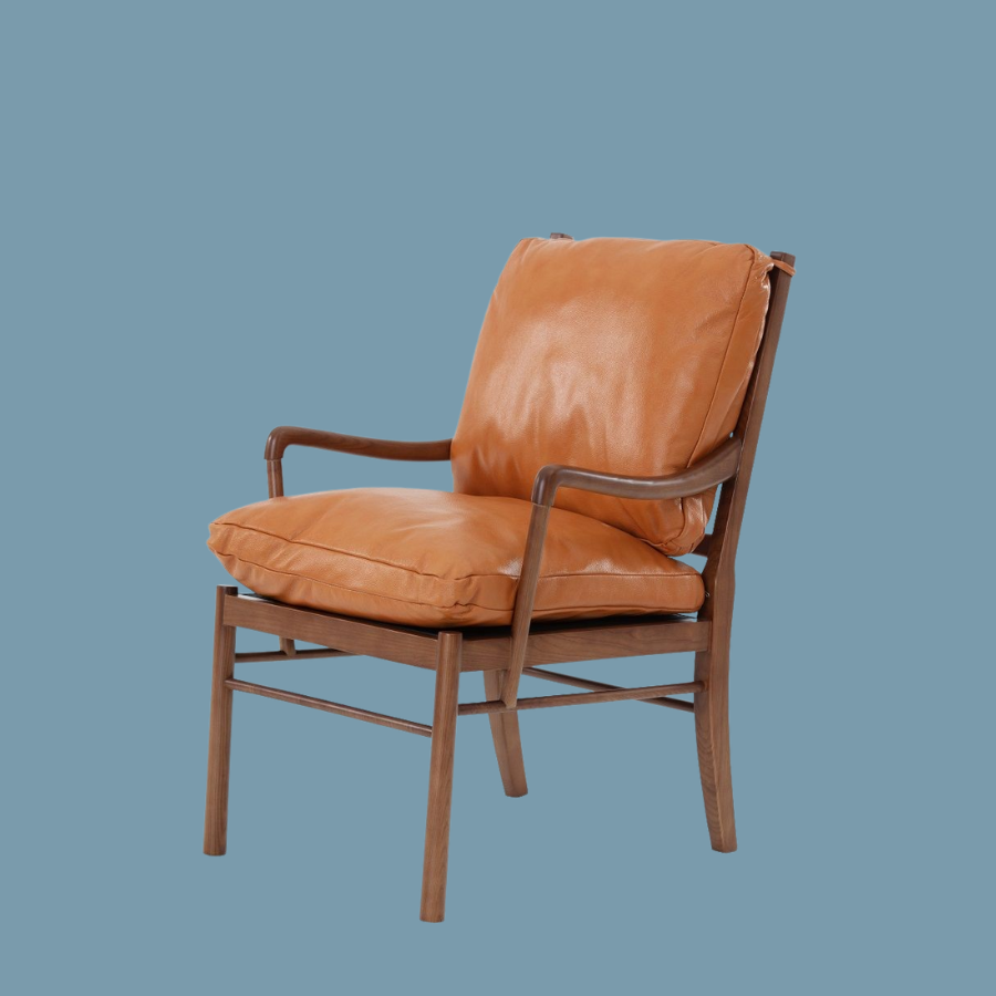 Replica Colonial Chair by Ole Wanscher OW149 Lounge Chair with Tan Leather Solid Ash timber frame with a Walnut finish, crafted with expertly shaped timber arm rests. Two beautiful, soft Italian Leather cushions in Tan with matching leather straps securing the cushions to the frame.