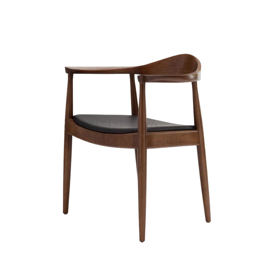 Solid Ash Timber Dining Chair with Walnut Stain. Generous Arm rest and back support and Black soft padded seat.