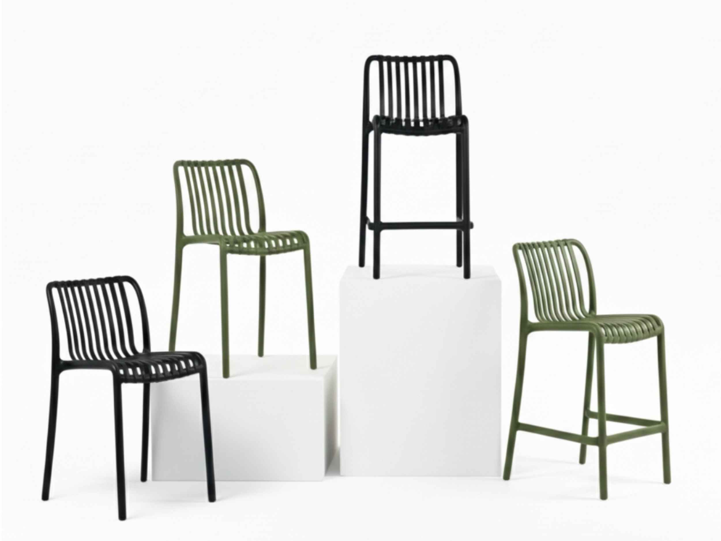 Bordeaux range of polypropylene outdoor dining chairs and counter stools in black and olive on white plinths.