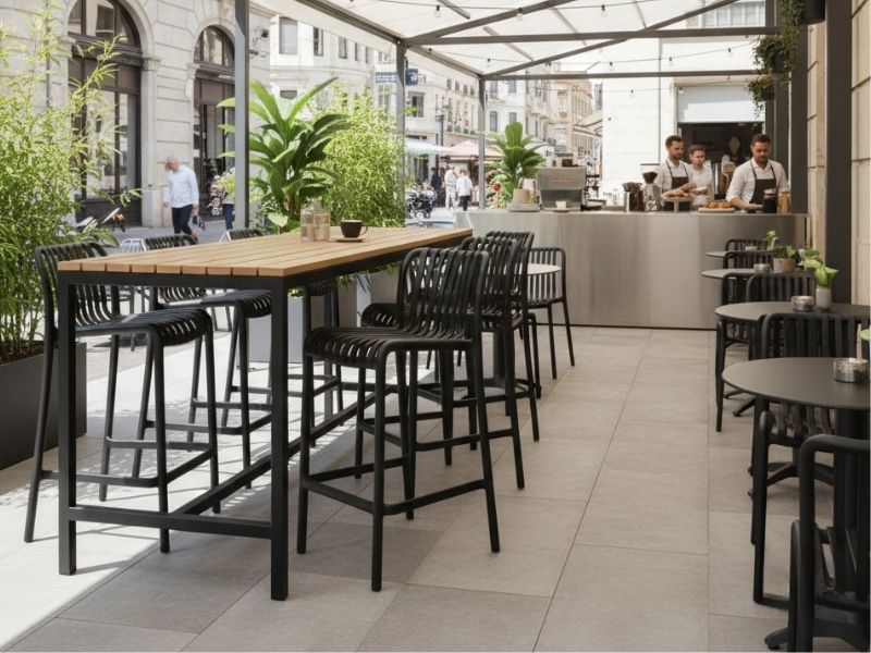 Bordeaux Stacking Polypropylene Outdoor Counter Stools 65cm used in a modern commercial cafe alfresco dining area.
