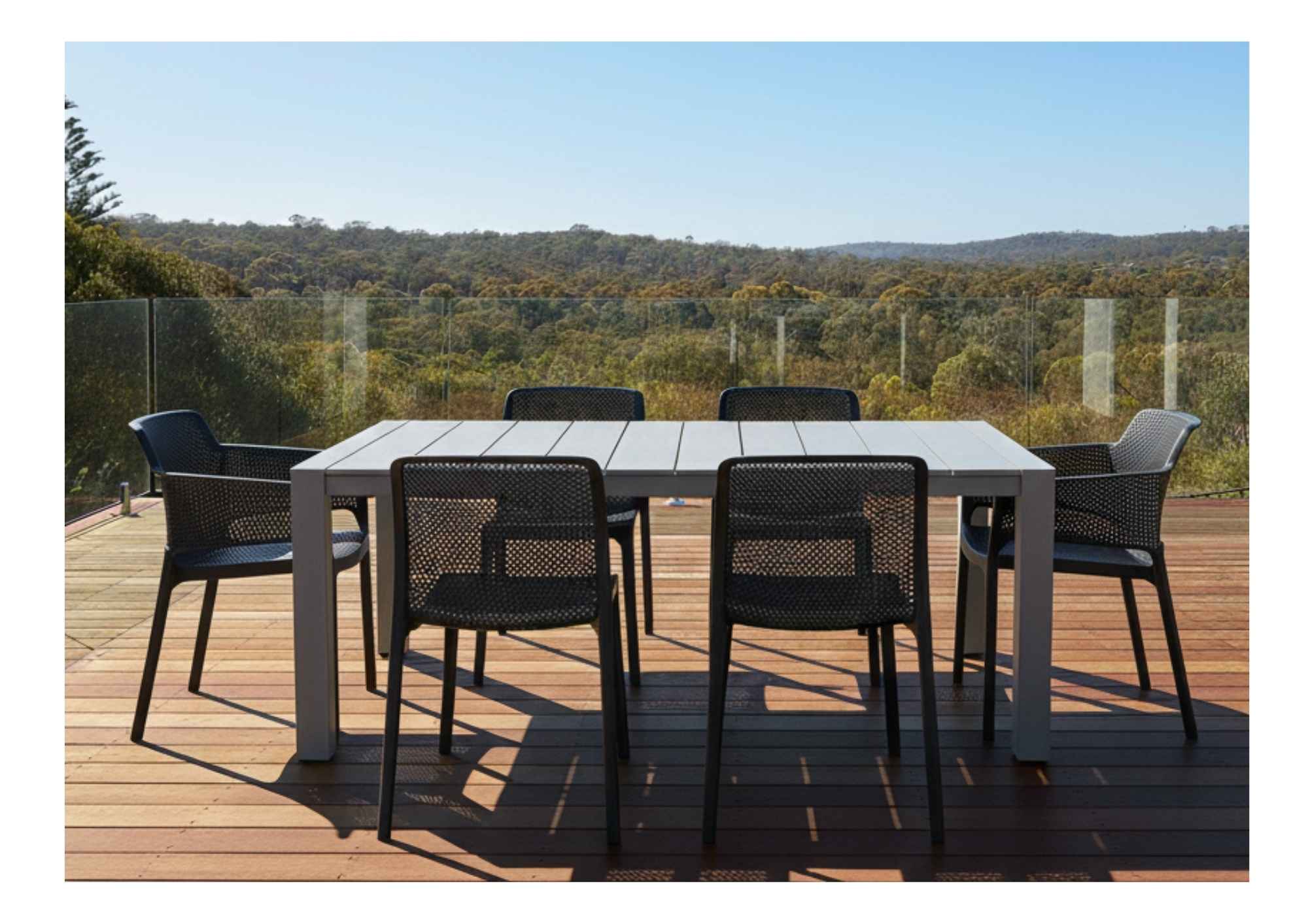 Create Your Dream Patio: Shop Designer Outdoor Chairs for Summer Entertaining. Stylish outdoor dining chairs in a modern backyard setting, perfect for summer entertaining.