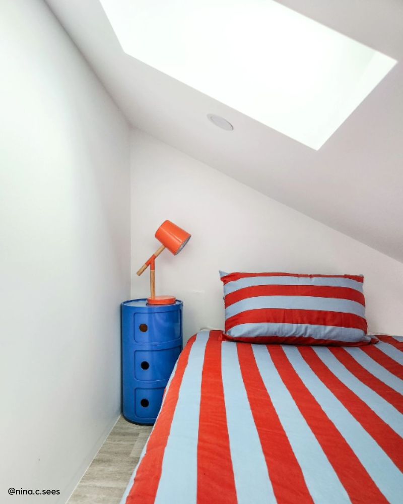 Kids Bedroom Bedside Table Ideas Replica Componibili bedside table styled next to a child's bed with a bright colourful doona cover.