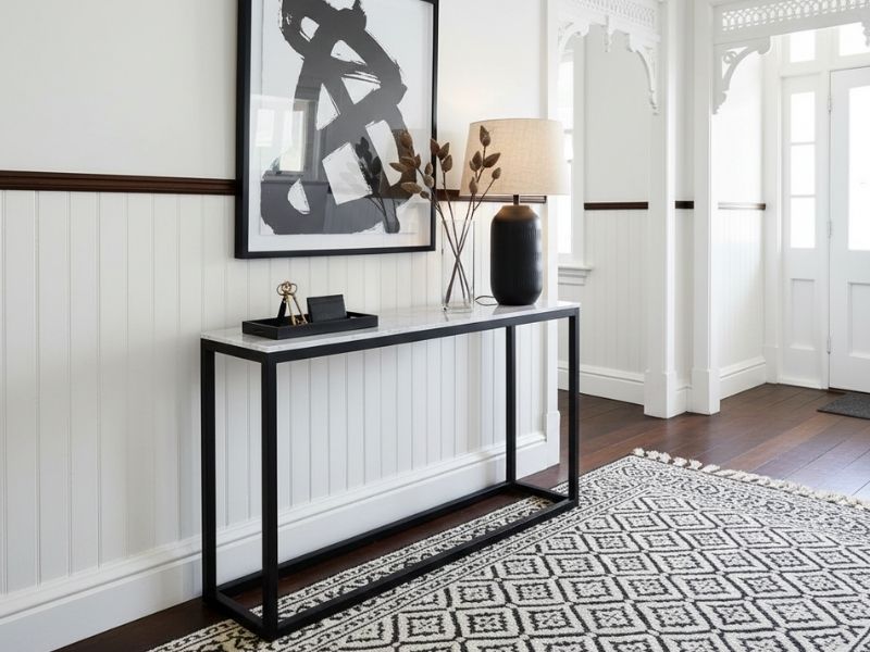Linder Marble Entrance Hall Table styled in a modern hallway, featuring a solid stone top.