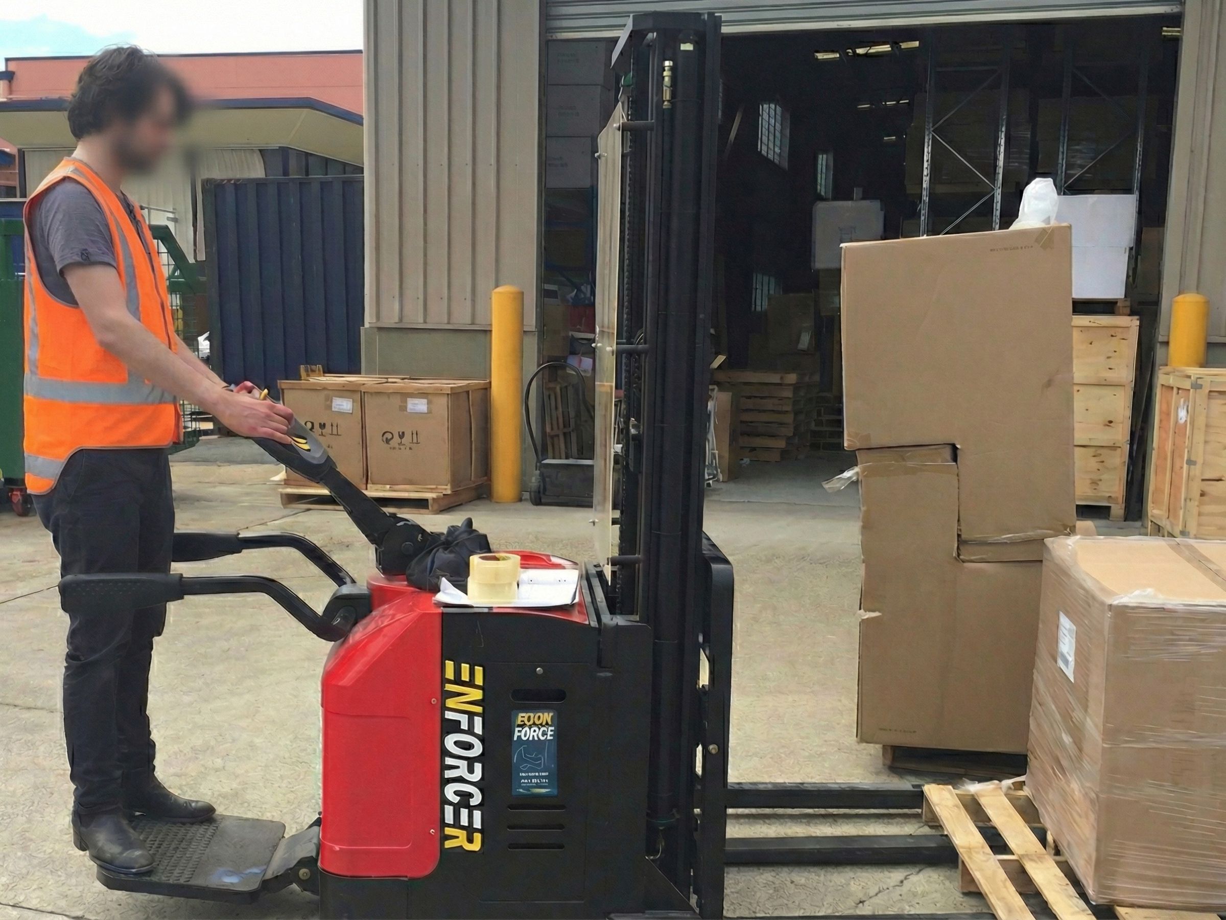 Worker moving cartons at the Replica Furniture Brisbane warehouse, ready for immediate dispatch (no drop-shipping).