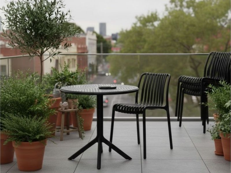 Space-Saving Storage: Stackable Bordeaux Chairs for Cafes & Venues. Bordeaux Stacking Polypropylene Outdoor Dining Chairs, demonstrating efficient vertical storage for cafes and restaurants.